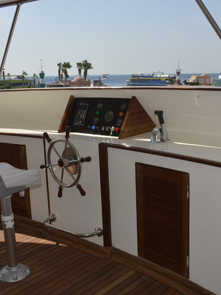 Guest reading in bed on overnight yacht Hurghada