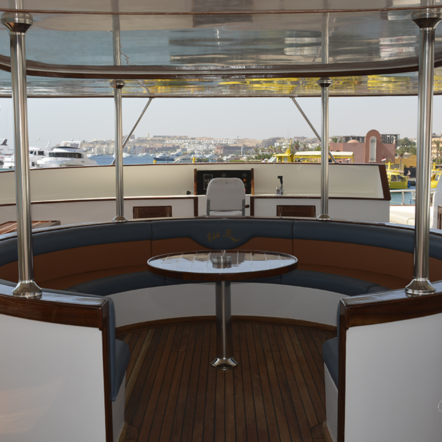 Elegant table setup for two on yacht deck