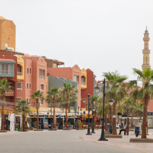 Marina promenade in Hurghada at night with lights and visitors